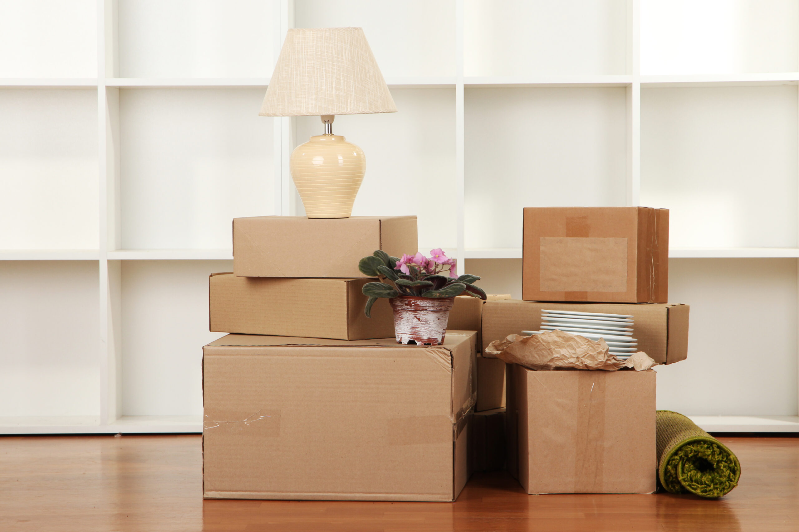 Moving boxes stacked in a living room