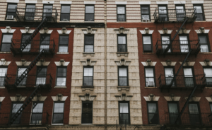 Facade of a New York City apartment building with fire escapes