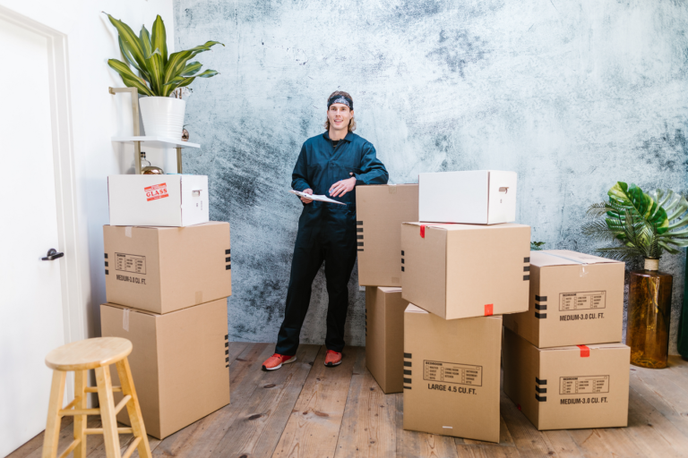Stacked moving boxes in an apartment being cleared