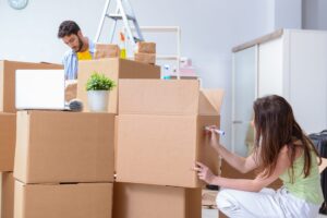 People packing boxes in a hurry