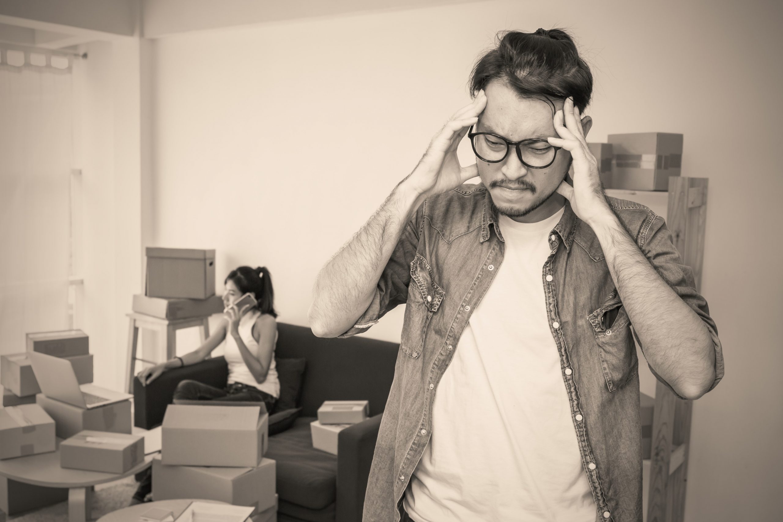 Man looking stressed with his head in his hands