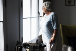 Older woman standing in her apartment