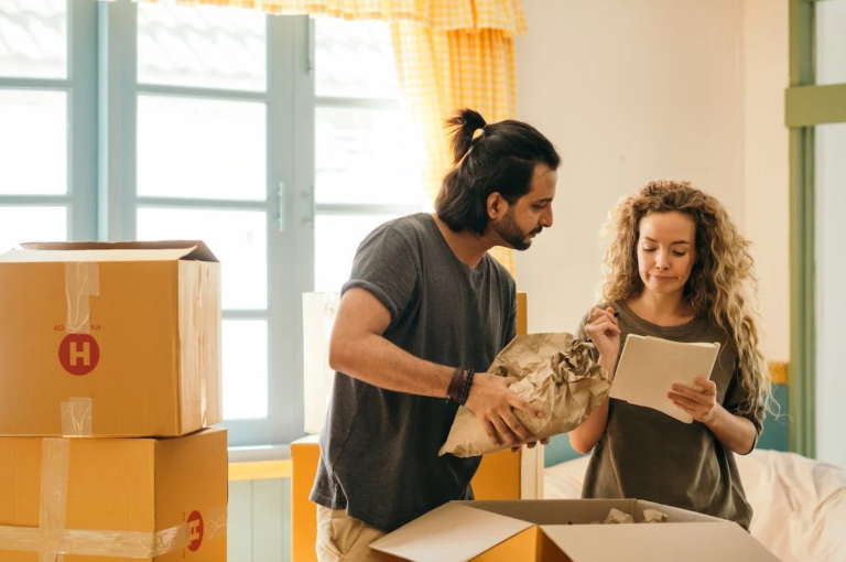 Couple packing boxes before moving day